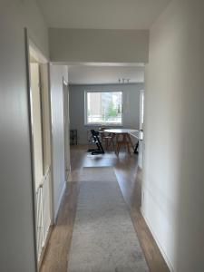 a hallway with a table and a dining room at New 4 bedroom apartment in Malmö in Malmö