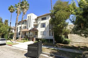 a tv sitting in front of a building at Spacious 2BR/2.5BA + Game Room in Glendale