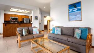 a living room with a couch and a coffee table at The Shores at Waikoloa 117 in Waikoloa