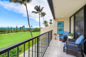 a balcony with a view of a golf course at Country Club Villas 311 in Kailua-Kona