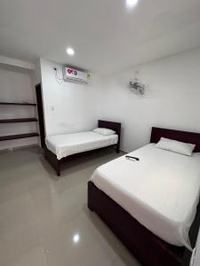 Postel nebo postele na pokoji v ubytování Hotel Casa Evan