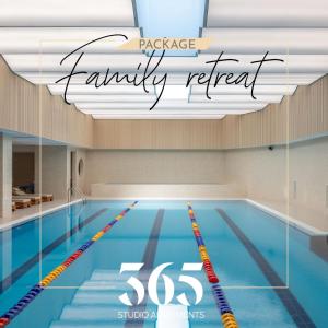 a swimming pool with the words parade family retreat at Studio Apartments 365 in Tirana