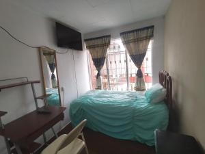 Postel nebo postele na pokoji v ubytování Casa Kitus