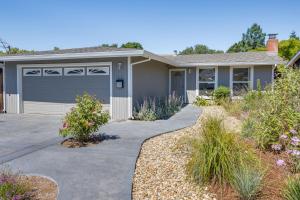 a house with a driveway and a garage at Inviting Home with Patio Walk to Downtown Novato! in Novato