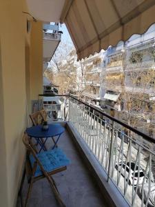 a balcony with a table and a view of a building at City Center Beauty in Serres