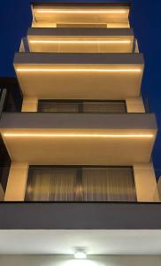 a set of stairs in a building with lights at P J Luxury Suites in Serres
