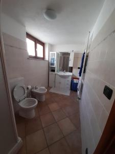a bathroom with two toilets and a sink at Il Paradiso CIR 0003 in Allein