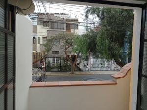 a view of a street from a window at Private Guest House in Lima