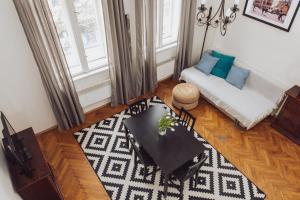 a living room with a couch and a table at Kraków Wawel Zwierzyniecka in Krakow