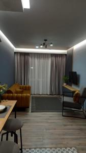 Ruang duduk di Comfort Apartment 2