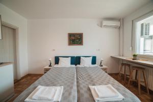 Postel nebo postele na pokoji v ubytování Arena East Apartment