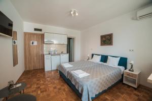 Postel nebo postele na pokoji v ubytování Arena East Apartment