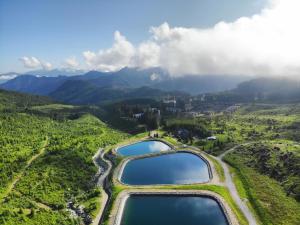 an aerial view of two lakes in the mountains at Mountica Jasná in Belá