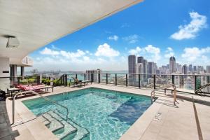 a swimming pool on a balcony with a view of the city at Lunabase Heavenly View in Miami