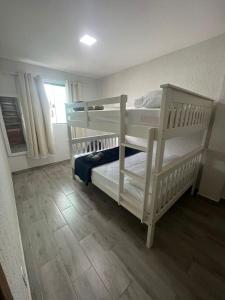 Katil atau katil-katil dalam bilik di Meu Loft Barra Nova 4