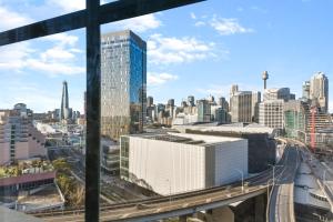 a view of a city skyline from a building at Goldsbrough 2 bedrooms split apartment in Sydney