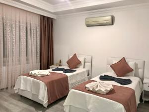 Ένα ή περισσότερα κρεβάτια σε δωμάτιο στο Tyana Home-1