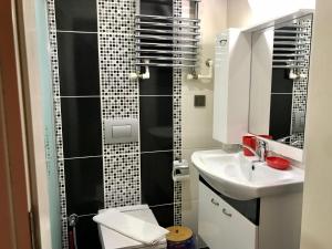 a small bathroom with a sink and a shower at Tyana Home-1 in Kaş +27 photos