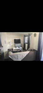 a hotel room with a bed and a desk at La cigale et la fourmie in Le Castellet