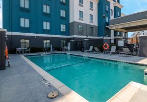 a swimming pool in front of a building at Best Western Eastland in Eastland