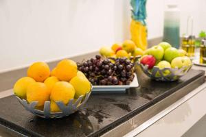 three bowls of fruit sitting on a counter at Sonesta Maho Beach All Inclusive Resort Casino & Spa in Maho Reef