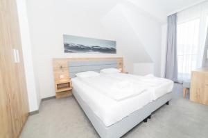 Кровать или кровати в номере VacationClub - Aparthotel Czarna Góra 409