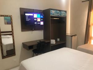 Postel nebo postele na pokoji v ubytování Hotel de Minas