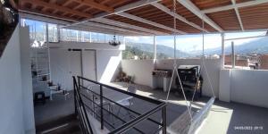a balcony of a building with a view of a mountain at Jacky's Home Bolognesi in Huaraz