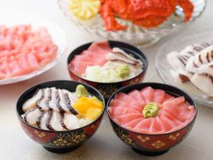 four bowls filled with different types of food on a table at APA Hotel Sapporo Odori Ekimae Minami in Sapporo