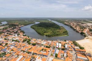 an aerial view of a city and a river at Pousada La Duna Lençóis Maranhenses in Barreirinhas