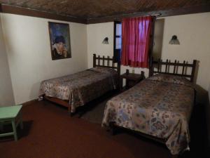 Postel nebo postele na pokoji v ubytování Hotel Molino del Rey