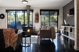 a living room with a couch and a fireplace at Ablac House in Glenlyon
