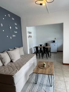 a living room with a couch and a table at - Cambacuá VM - in Villa María