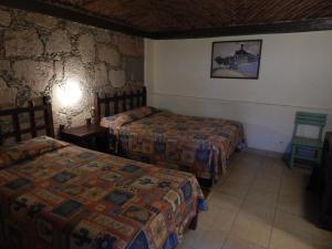 Postel nebo postele na pokoji v ubytování Hotel Molino del Rey + 26 fotografií