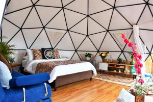 Postel nebo postele na pokoji v ubytování Glamping Claro de Luna