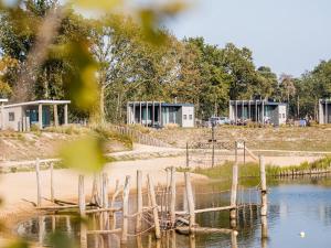 a view of a lake with buildings in the background at Chalet by Beach and Harbor with Terrace in Well