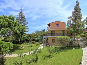 a villa with a view of the garden at Seaside Serenity Stay in Karteros