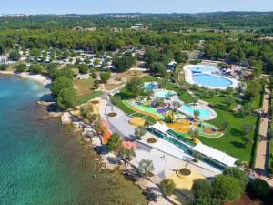 an aerial view of a resort next to the water at Comfortable chalet 4 5 km from Rovinj in Rovinj