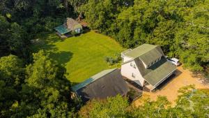 an overhead view of a house in the woods at Peaceful & Modern Historic Norcross Home in Norcross
