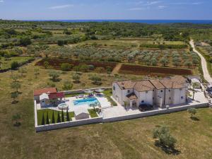 an aerial view of a house with a swimming pool at Villa in Rovinj with Pool and Sauna in Rovinjsko Selo