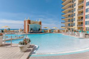 a large swimming pool in front of a hotel at Emerald Grande W621 in Destin