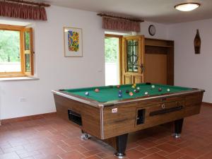 a pool table in a living room with afits at Rural Villa with swimming pool in Kloštar