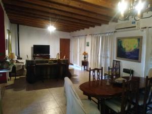 a living room with a table and a couch at El Resueyo de Saladillo in Saladillo