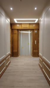 an empty hallway with a door in a building at Hotel Grand Galaxy in Yangon