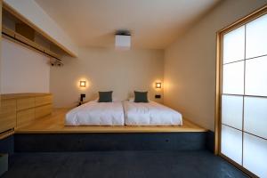 Llit o llits en una habitació de yubune