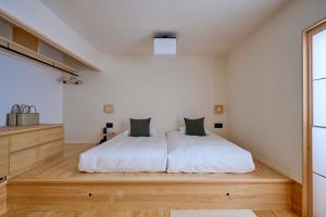 Llit o llits en una habitació de yubune