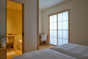 Llit o llits en una habitació de yubune