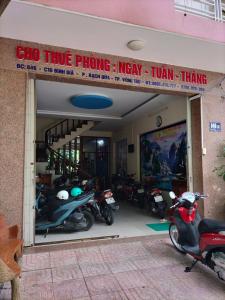 a store with motorcycles parked in a garage at Nhà Nghỉ KHÁNH NGỌC in Vung Tau