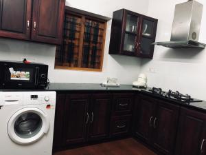 Kuchyň nebo kuchyňský kout v ubytování Garuda Suites