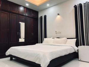Postel nebo postele na pokoji v ubytování Garuda Suites